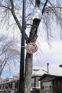 A medallion for the Historic Chicago Bungalow Initiative hangs on a tree in the neighborhood. The three-year-old project, started by Mayor Richard Daley, is helping to preserve and improve Chicago’s bungalow neighborhoods.